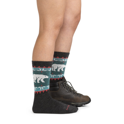 Image of model wearing 5017 Vanna Grizzle Hiking Socks in Charcoal colorway and dark brown hiking boot on one foot