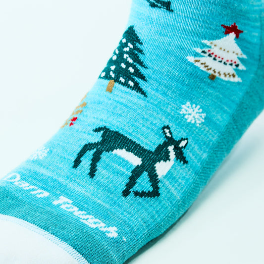 close up of forefoot womens 6142 Yuletide Wild Crew Lightweight with Cushion in aqua showing deer and decorated trees